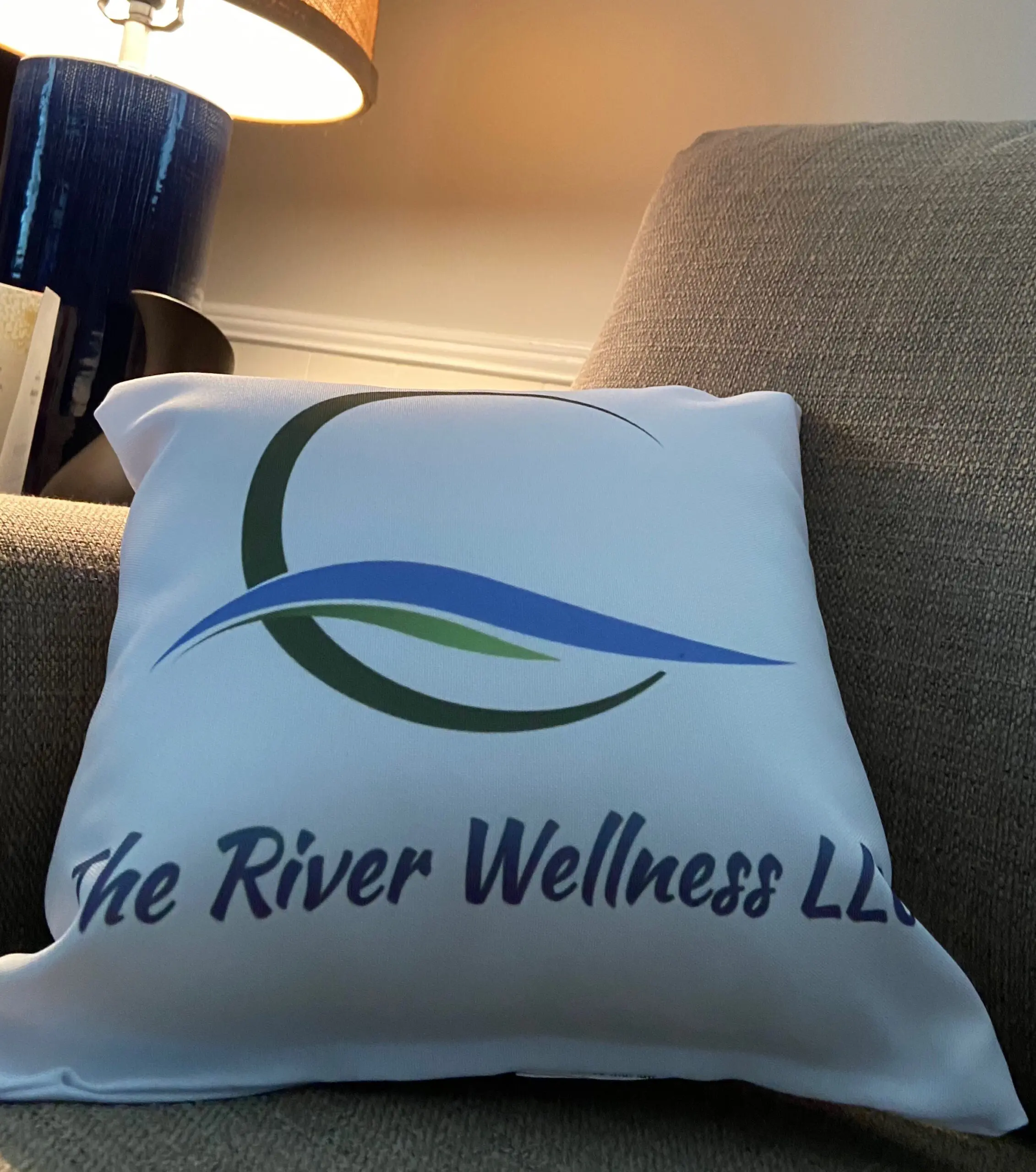 A pillow that says the river wellness llc