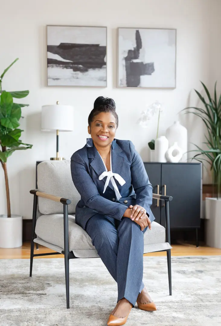 Smiling businesswoman in stylish suit.